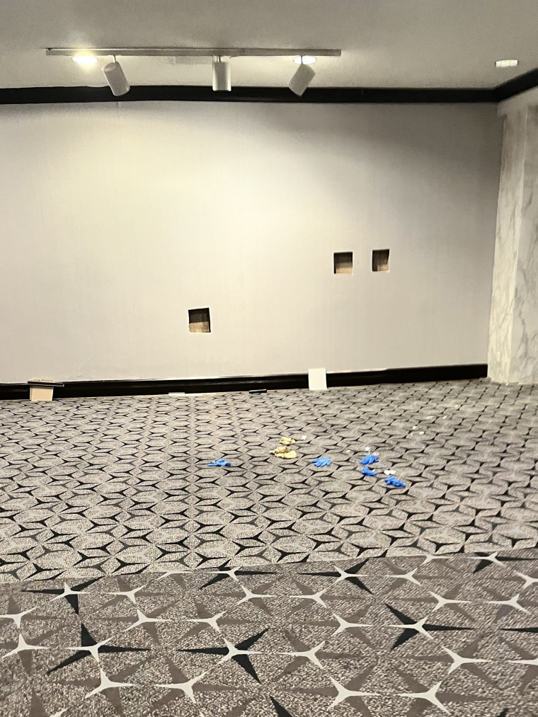 Three square holes in an interior wall of a hotel.