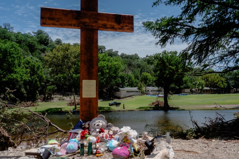 A 10-foot cross is seen along the banks of the Guadalupe River.