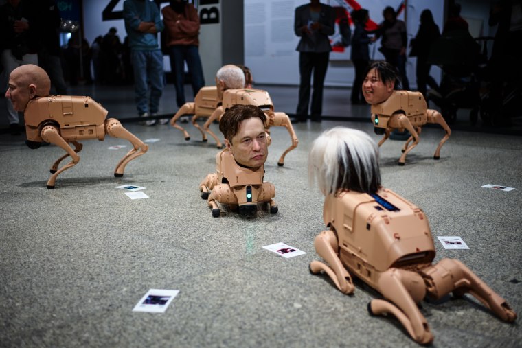 Robots in the likeness of Jeff Bezos, Elon Musk, Andy Warhol and Kim Jong Un, displayed at the installation titled Regular Animals by the artist Beeple.