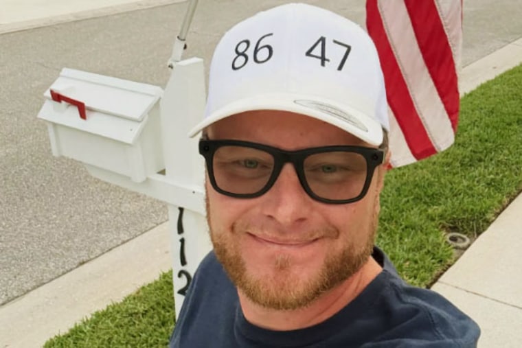 Florida congressional candidate Mark Davis wears an "8647" hat.