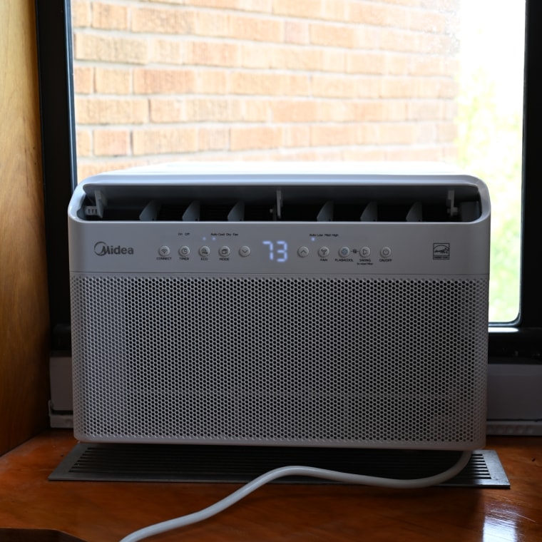 A picture of the Midea U-shaped AC in the window of NBC Select writer Harry Rabinowitz.