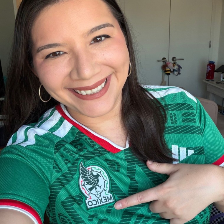 Woman wearing Mexico Adidas jersey.