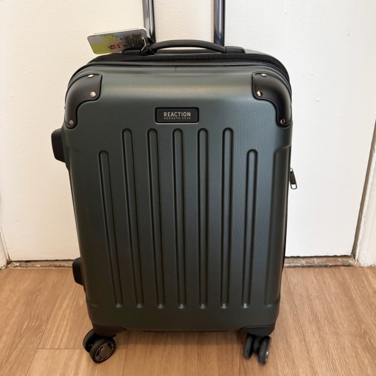 Unlike many other carry-on suitcases she's tried, our tester shared that this Kenneth Cole option "rolls great on multiple surfaces."