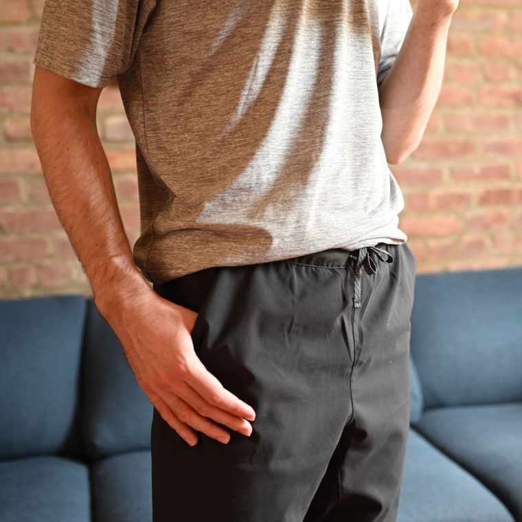 A close up of a man wearing the Patagonia Men's Terrebonne Joggers in black.