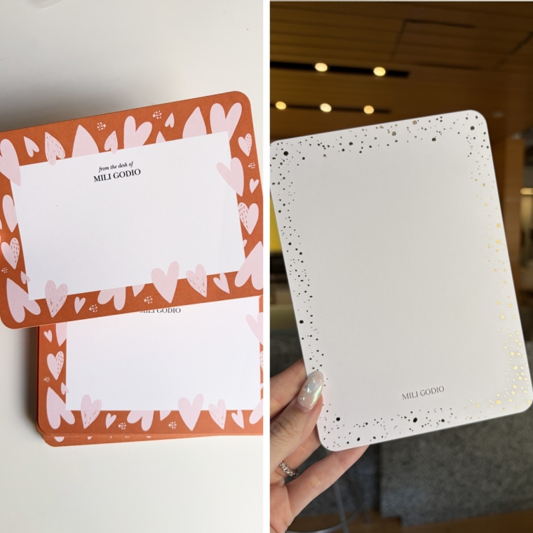 Woman holding two styles of note cards