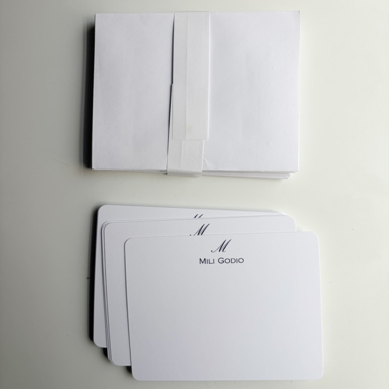 Note cards and envelopes on a white background