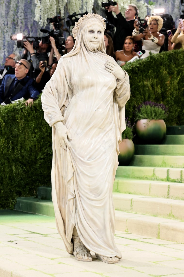 Heidi Klum dressed as a marble statue.