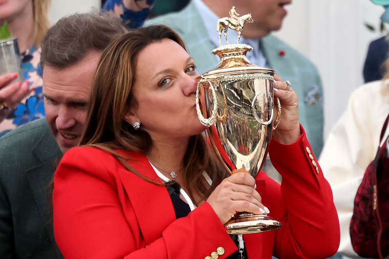 Cherie DeVaux, trainer of Golden Tempo, celebrates with the Kentucky Derby trophy at Churchill Downs on May 2, 2026 in Louisville.