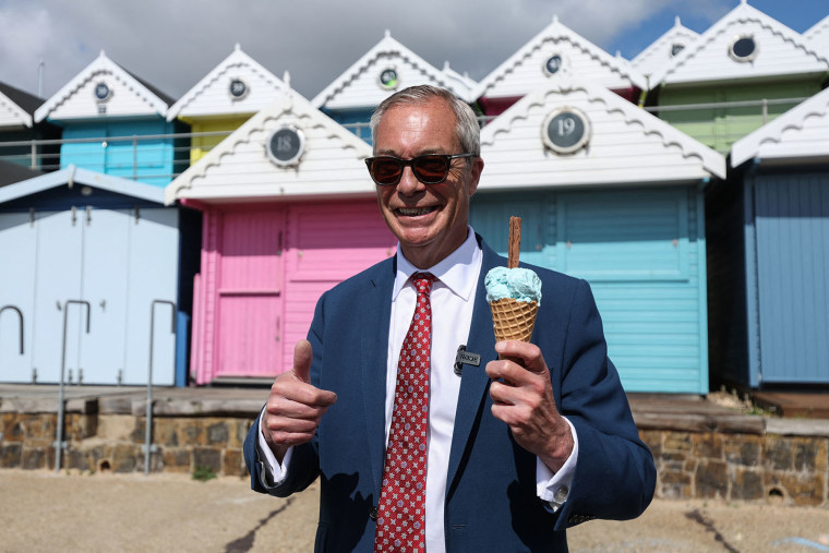 Reform UK leader Nigel Farage poses with an ice cream