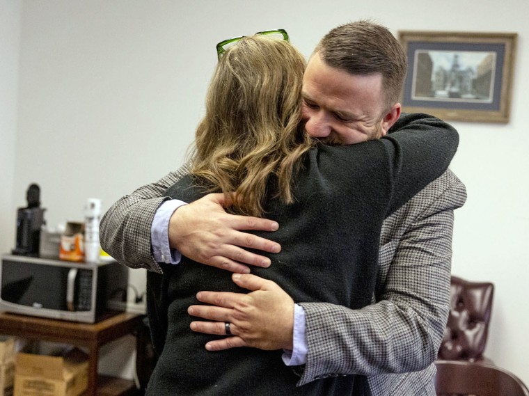 Joseph Cleveland is embraced after the hearing where he gave an impact statement.