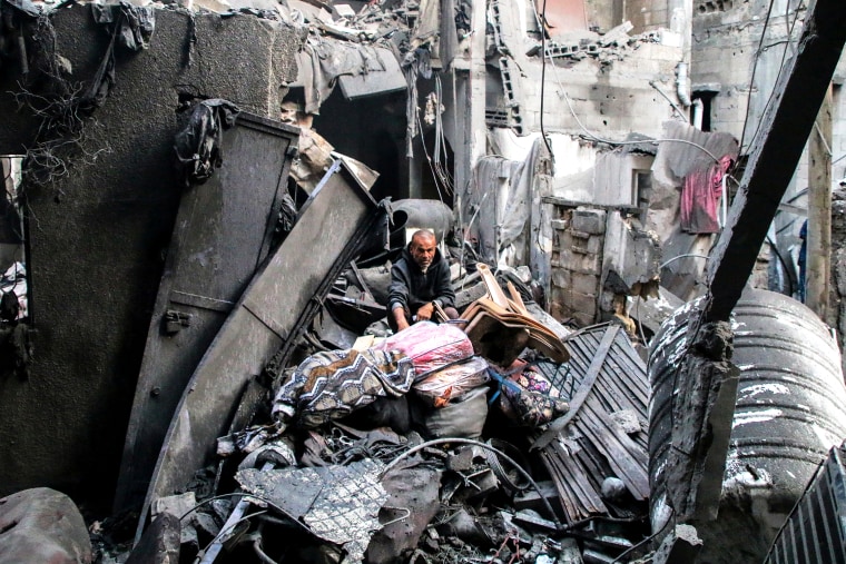 Gaza Residents Inspect Damage From Air Strikes In Al-Shati Refugee Camp In Gaza