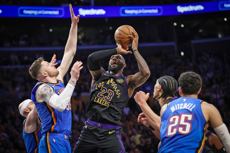 Los Angeles Lakers forward LeBron James struggles to get a shot off o