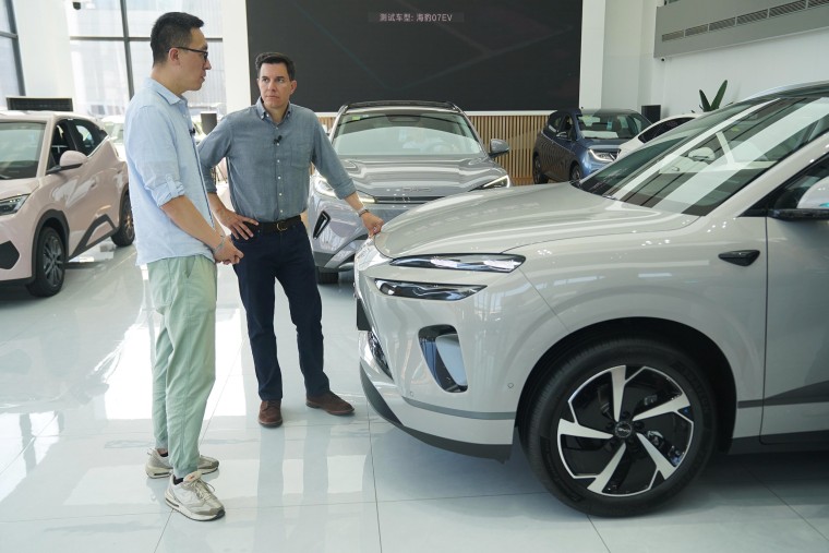 NBC News' Tom Llamas at a BYD dealership in Beijing this week.
