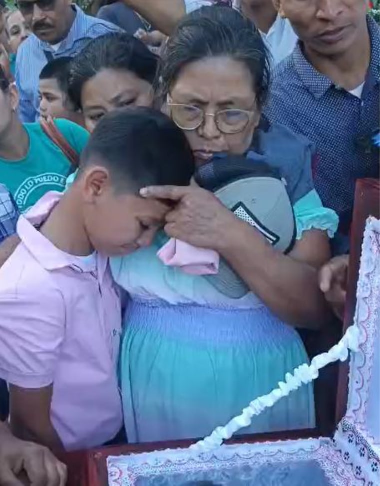 Victor Manuel Diaz's mother and son at his funeral.