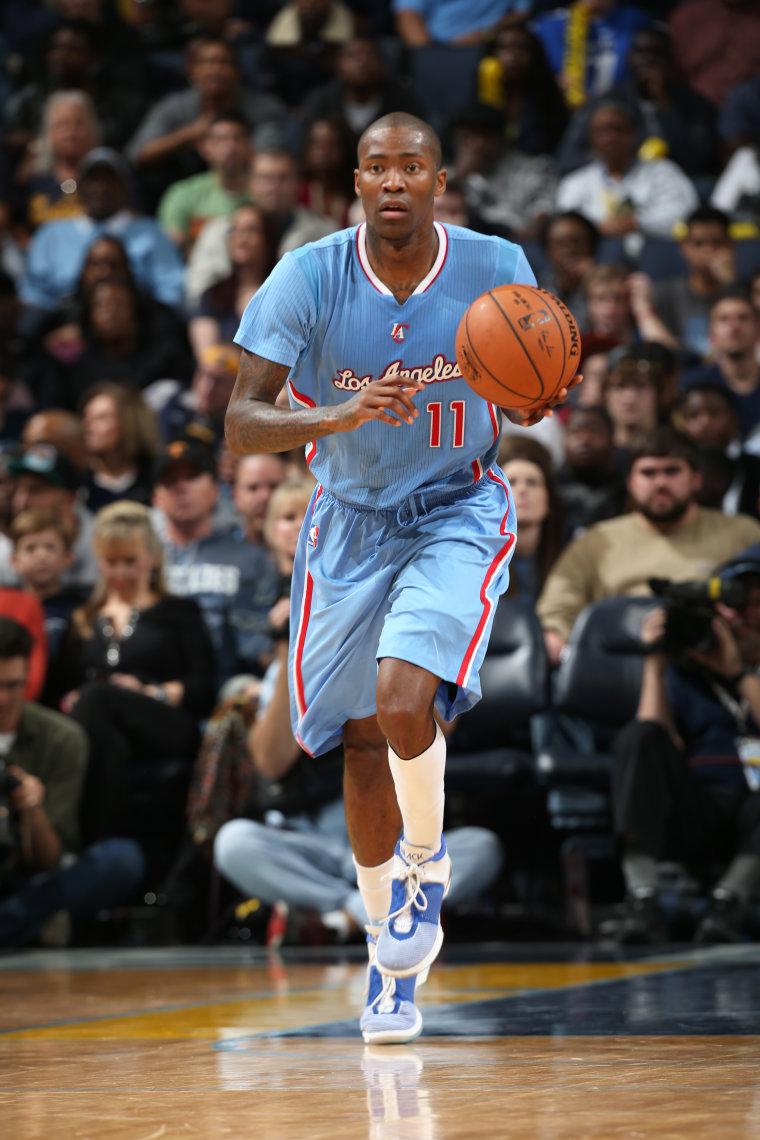 Jamal Crawford dribbles a basketball with his left hand during an NBA game.