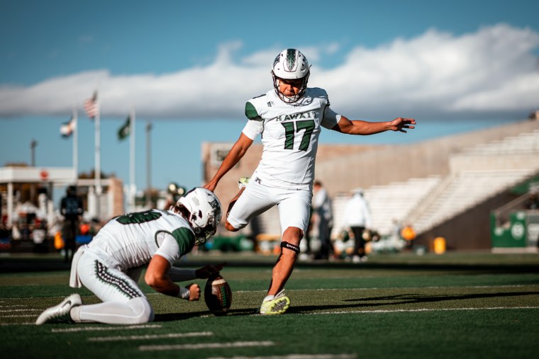 Kansei Matsuzawa prepares to kick a football