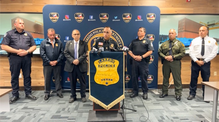Chief Miguel A. Rodriguez Jr., center, speaks