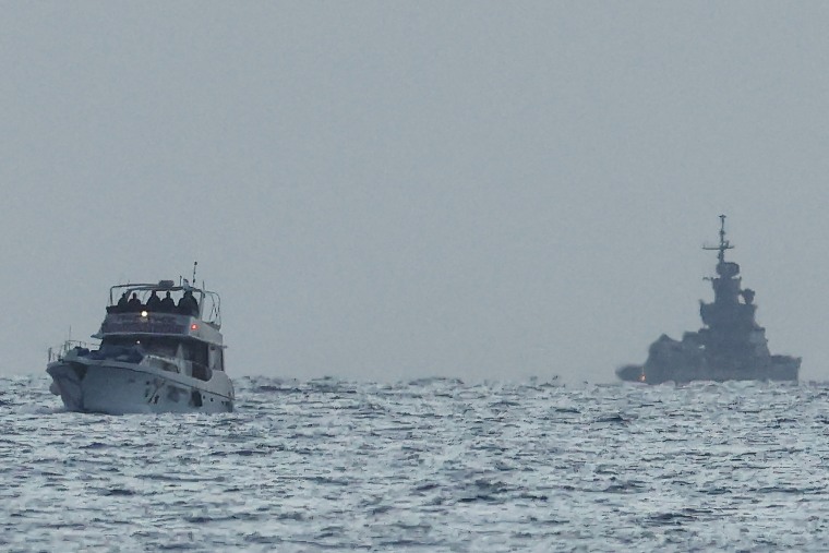 A boat bearing symbols of one of the vessels belonging to the Gaza-bound aid flotilla (L) and intercepted by the Israeli navy in international waters.