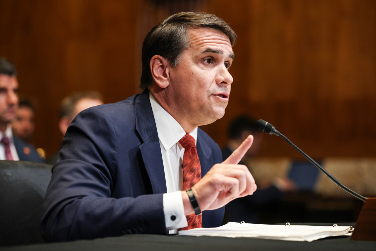 Todd Blanche testifies while seated