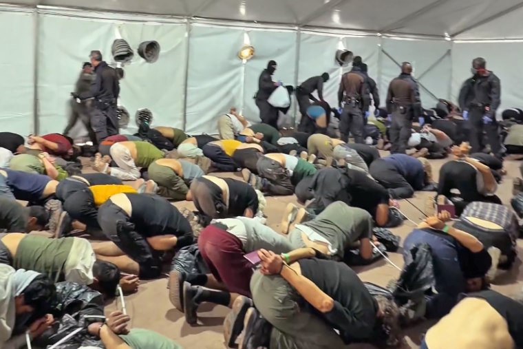 Detained members of a flotilla kneel in a video posted by Israel's Security Minister Itamar Ben-Gvir.