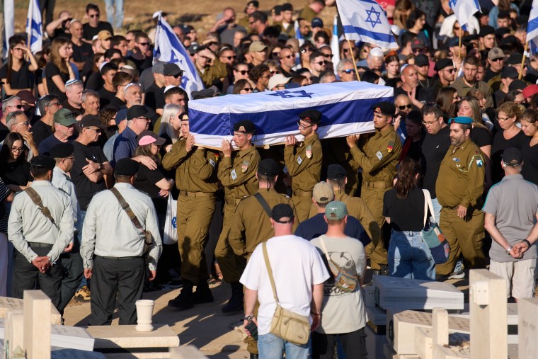 Image: Israeli soldiers carry the casket of Staff Sgt. Noam Hamburger, who was killed in a Lebanese drone attack on northern Israel, during his funeral in Atlit, Israel.