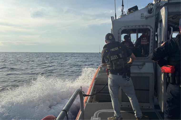 U.S. Coast Guard Investigative Service officers seize the Soulmate, the boat Lynette and Brian Hooker were on the night she disappeared.