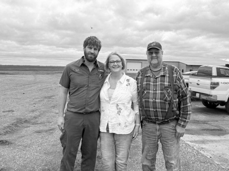 Travis, Arda and Loren Van Regenmorter on their family farm in Sioux Center, Iowa.