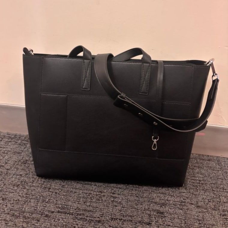 Calpak Haven Tote on the ground.