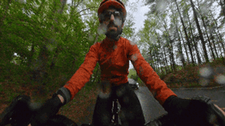 A video of NBC Select reporter Harry Rabinowitz cycling in the rain.