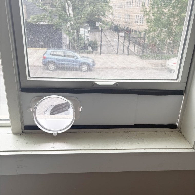 The base of the Midea portable air conditioner set up in my living room window. 