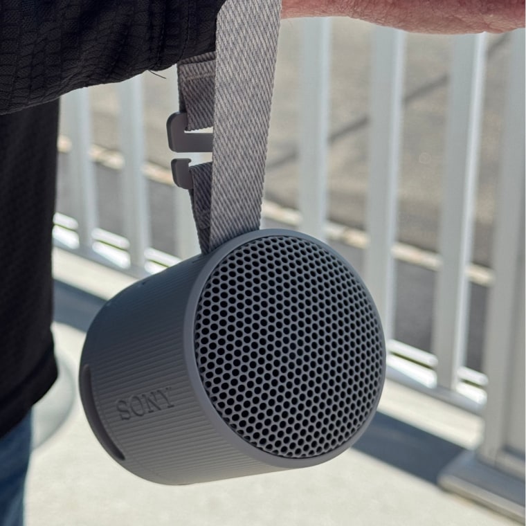 The Sony speaker has a convenient carrying strap that I can hold on my wrist.