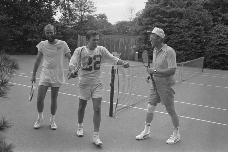 President Gerald Ford, Chief of Staff Donald Rumsfeld, and David Kennerly, Personal Photographer to the President, following a Tennis Match on the White House Tennis Courts in 1975.