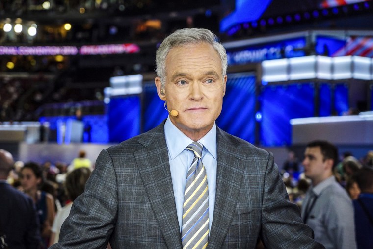 Scott Pelley seated on set