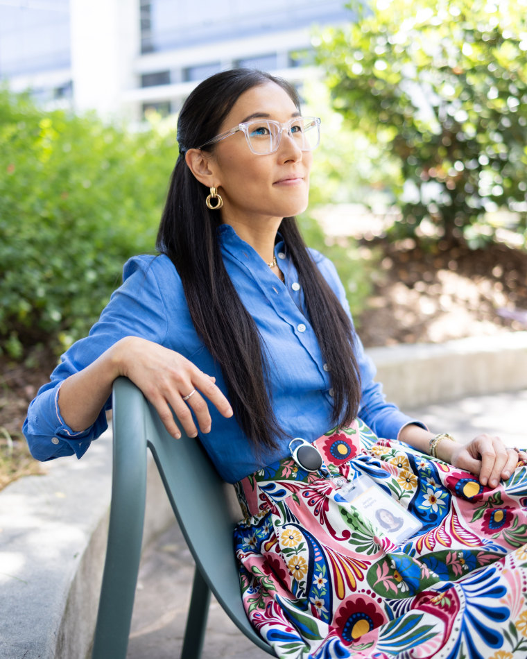 Jennie Magiera sits on a chair outside