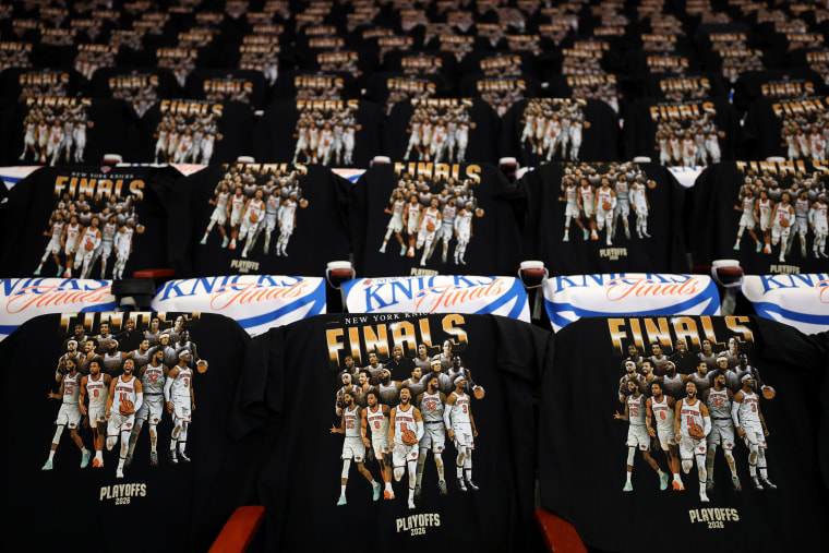 T-shirts celebrating the New York Knicks and the NBA finals on backs of seats.