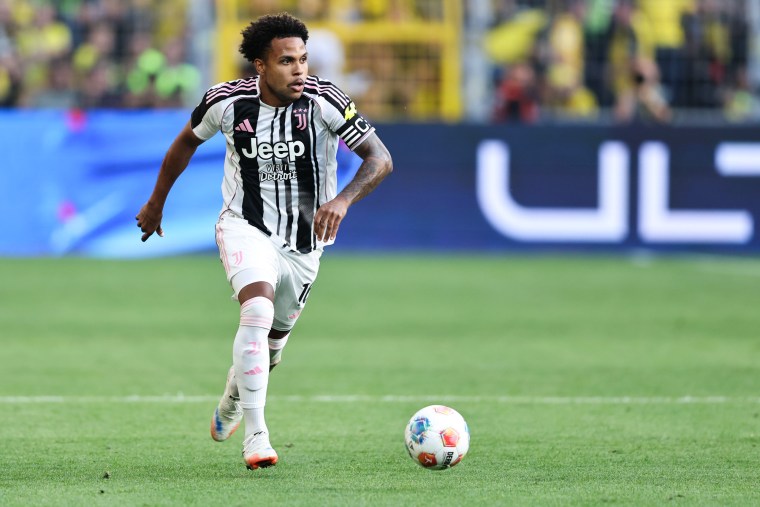 Weston McKennie runs while controlling the soccer ball on the field