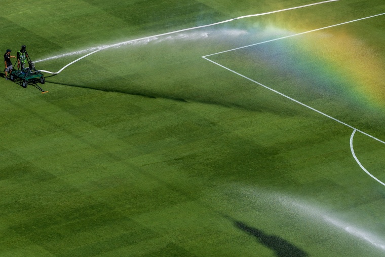 A rainbow is seen on the pitch at halftime as the grounds crew waters the grass during the FIFA Club World Cup 2025.