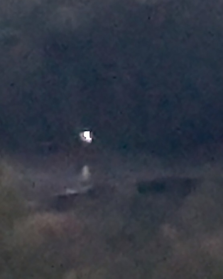 In October 2024, at approximately 1851 local time in the northeastern United States, an eyewitness observed a light source below the horizon, hovering above a pond at an estimated distance of 2,700 feet.
