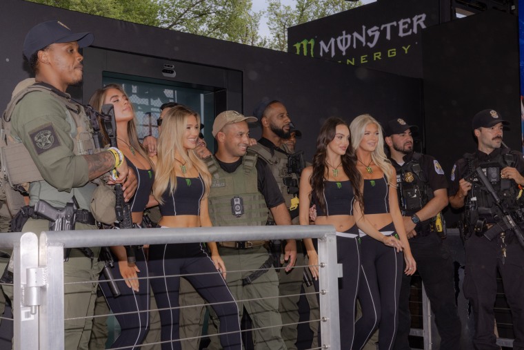 Washington, D.C.,
National Guard members pose for a photos with the "Monster Energy girls."