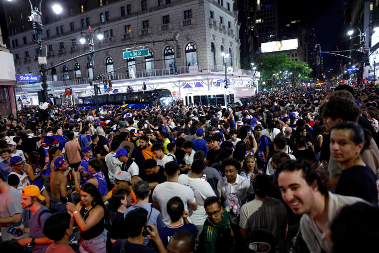 Knicks fans fill the street celebrating after the New York Knicks defeated the San Antonio Spurs in Game 5 of the NBA Finals.