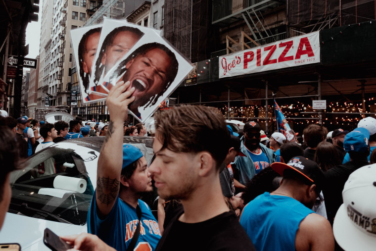 Fans crowd Fulton Street in celebration of Knicks’ NBA championship.