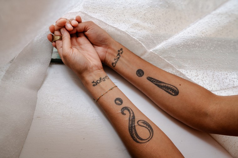 Veena's tattoos, which she got after leaving Real Love.