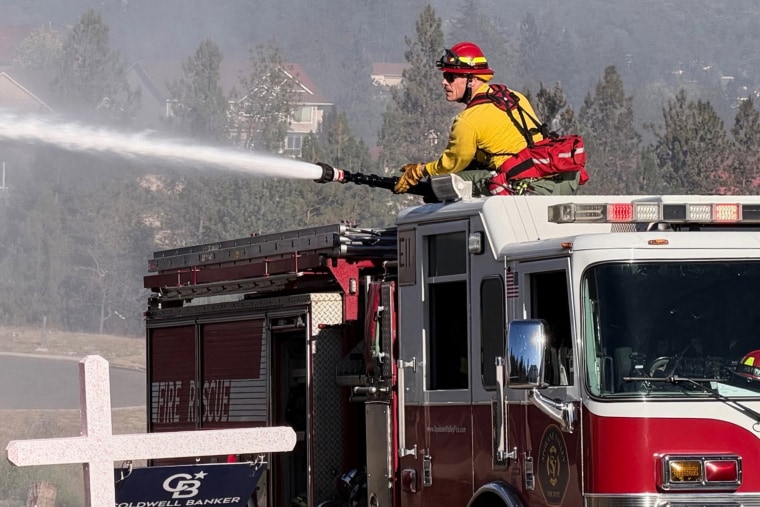 Fire crews battle the Upriver Fire on Tuesday, June 16, 2026, east of Spokane, Washington.