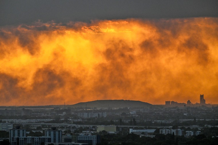 Smoke rises from a wildfire in west Miami-Dade County near Miami, Florida, on June 16, 2026. 
