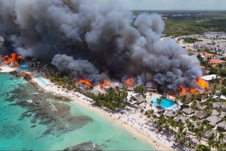 Videos shared by local media showed dark clouds of smoke billowing out above the Caribbean coastline, as flames engulfed the resort’s straw roof.