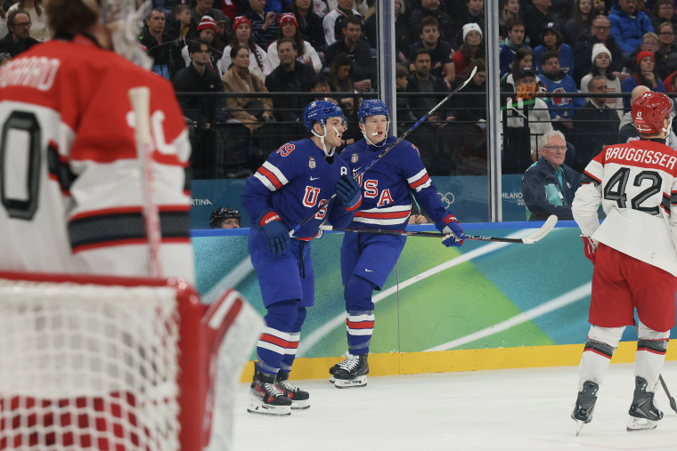Matthew Tkachuk, left, and Brady Tkachuk on the ice during gameplay.