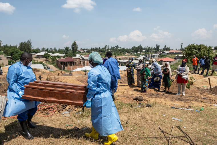 Red Cross workers prepare to bury Vanisa Anifa, a 6-month-old orphaned girl who died of Ebola, at the Bigo Cemetery.