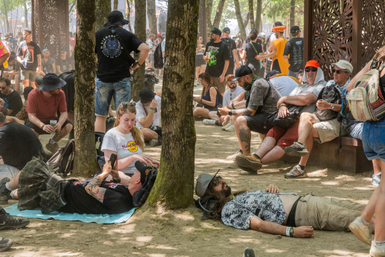 Festivalgoers seek shade at the Hellfest festival in Clisson, Loire-Atlantique, France