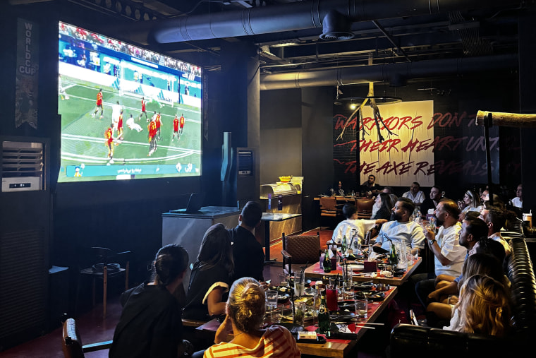 Iranian fans watch their national team's World Cup match against Belgium.