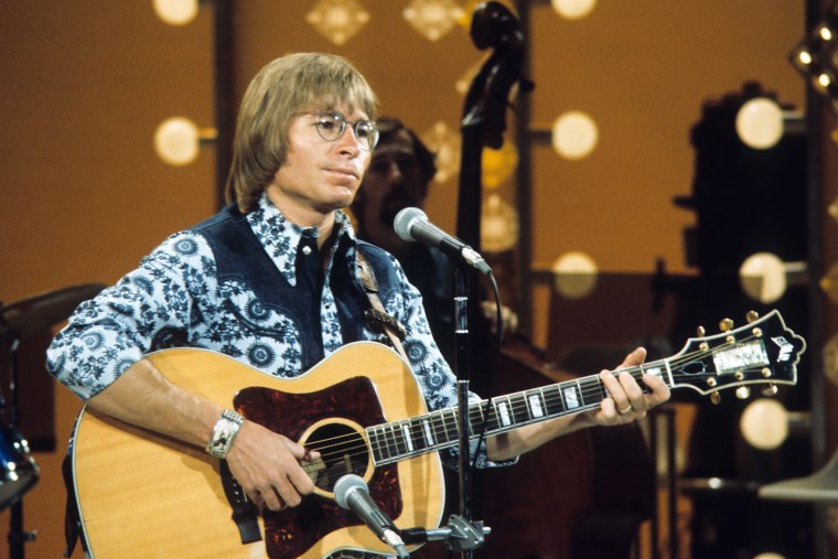 John Denver performs onstage